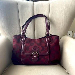Maroon colored gently used coach purse.